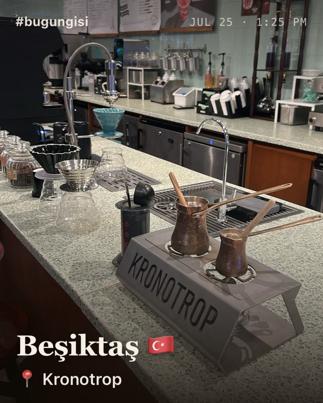 A photo of a coffee bar, stamped with the date and time, the city with the Turkish flag, and the spot, Kronotrop.